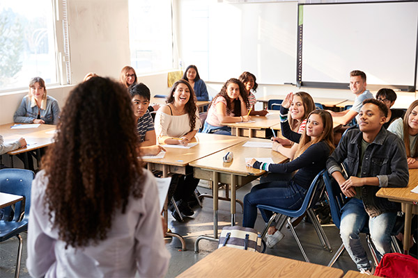 Teacher speaking to classroom of highschool kids