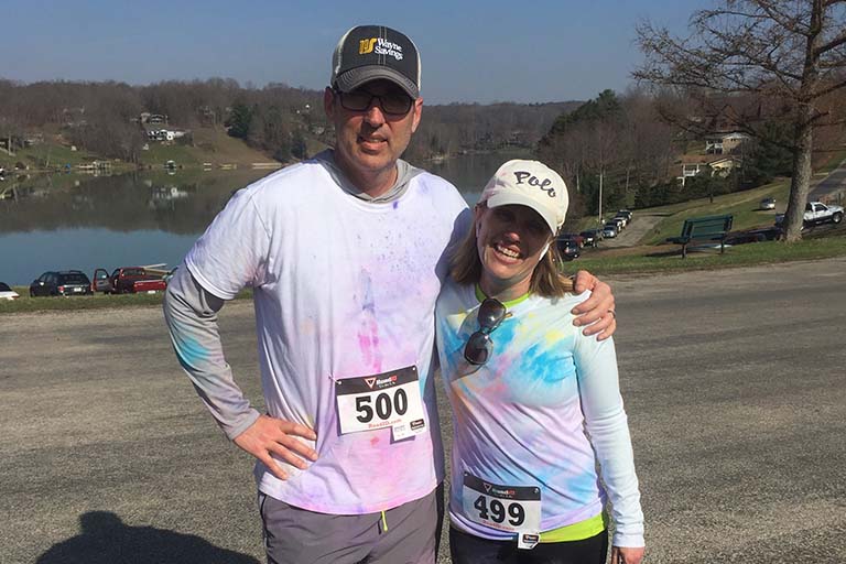 Two Participants in the Color Run posing for photo