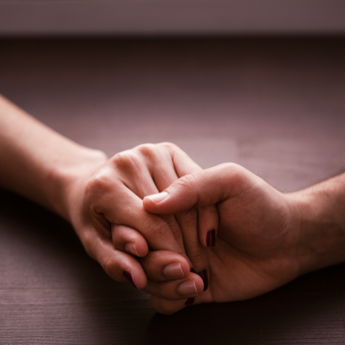 Holding hands to illustrate support