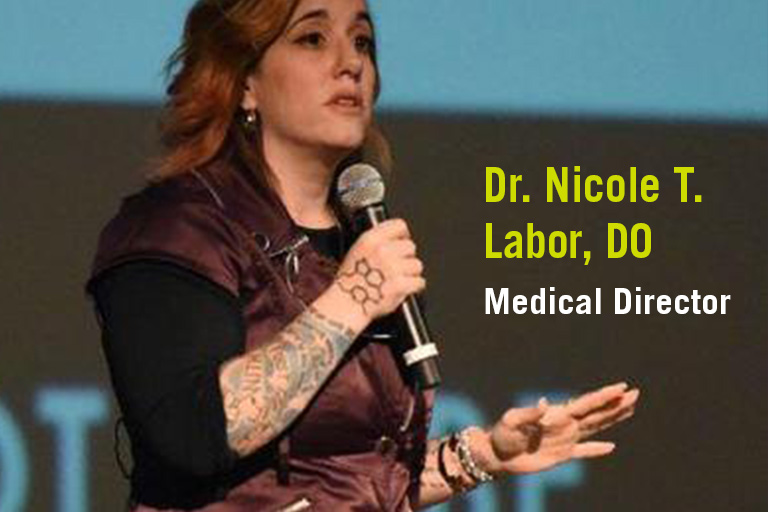 D.r Nicole T. Labor, DO Medical Director speaking at a conference